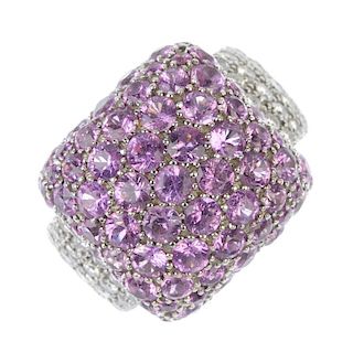 A sapphire and diamond dress ring. The circular-shape pink sapphire rectangular-shape cluster, to th