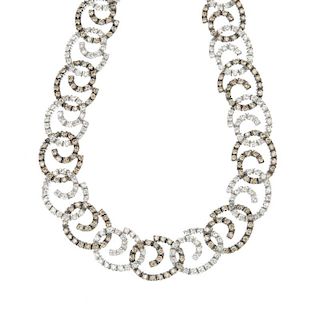A diamond necklace. Designed as a series of alternating brilliant-cut diamond and 'brown' brilliant-