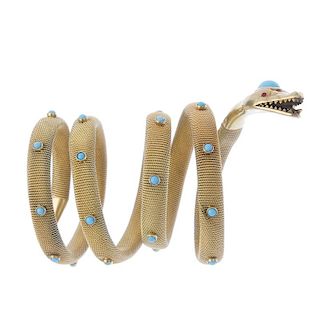 A turquoise coiled snake bracelet. The head set with an oval-shape turquoise cabochon together with