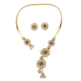 A sapphire and diamond necklace and earring set. The front designed as a series of oval-shape sapphi