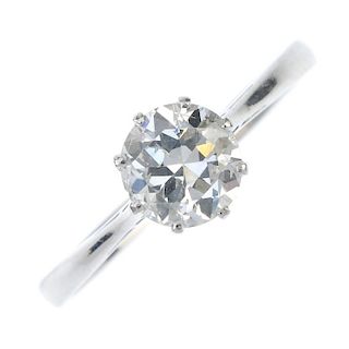 A diamond single-stone ring. The circular-cut diamond, to the tapered shoulders and plain band. Esti