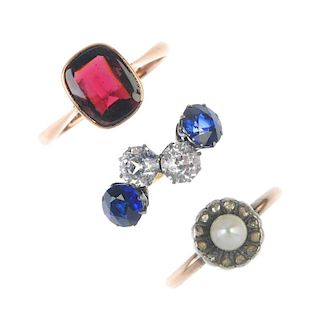 A selection of three early 20th century gem-set rings. To include a cultured pearl and diamond flora
