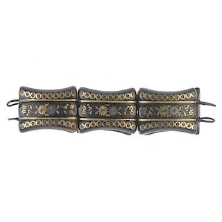 A late 19th century tortoiseshell pique bracelet. Designed as a series of tapered tortoiseshell piqu