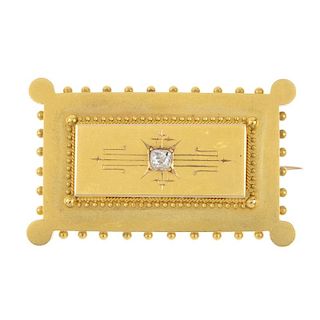 A late 19th century gold diamond brooch. Of rectangular outline, the old-cut diamond, inset to the g
