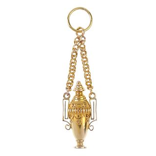 A late Victorian gold Etruscan revival pendant. The cannetille urn, with removable screw thread top,