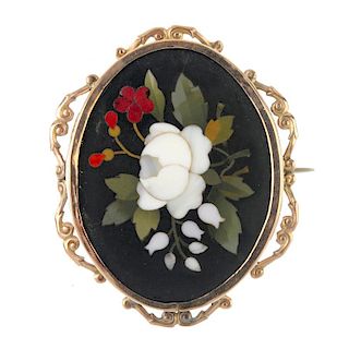 A Pietra Dura brooch and matching ear pendants. The brooch depicting a floral motif, to the black on