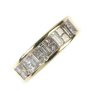 An 18ct gold diamond half-circle eternity ring. Designed as a series of baguette-cut diamonds, with