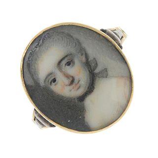 A late 18th century gold portrait miniature ring. The oval-shape panel painted to depict a woman in