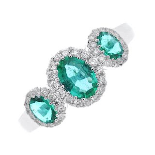 * An emerald and diamond triple cluster ring. Designed as a graduated series of oval-shape emerald a