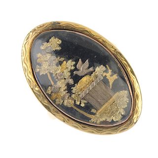 A late 18th century gold memorial ring. Of oval outline, depicting a nesting dove amongst foliage, t