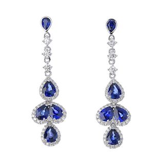 * A pair of sapphire and diamond ear pendants. Each designed as a pear-shape sapphire and brilliant-
