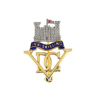 A 9ct gold Inniskilling Dragoon Guards enamel brooch. The initial monogram and blue enamel ribbon, t