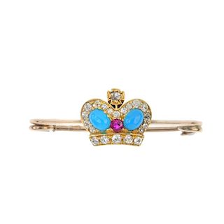 A diamond and gem-set brooch. Designed as a crown, set throughout with blue gem, synthetic ruby and