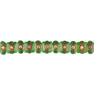 A diamond and enamel bracelet. Designed as a series of red and green enamel links, with diamond poin