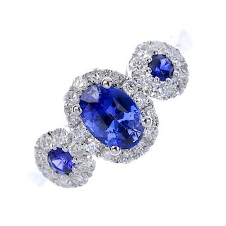 * A sapphire and diamond triple cluster ring. Designed as series of graduated sapphire and brilliant