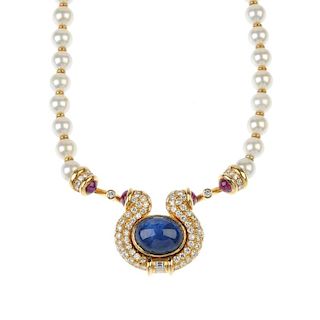 A sapphire, diamond, ruby and cultured pearl necklace. The front designed as an oval sapphire caboch