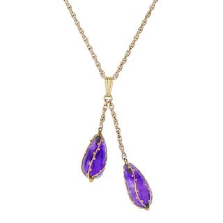 An amethyst pendant. Designed as two pear-shape amethyst drops, each within a wire and bead cage, su