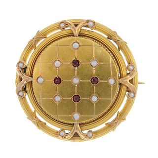 A late 19th century garnet and split pearl brooch. Designed as a series of circular-shape garnet and
