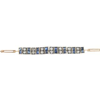 A mid 20th century sapphire and diamond bracelet. The alternating twin square-shape sapphire and sin