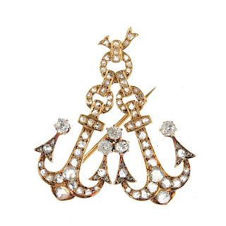 An early 20th century 18ct gold diamond double anchor brooch. The rose-cut diamond chain anchors, wi