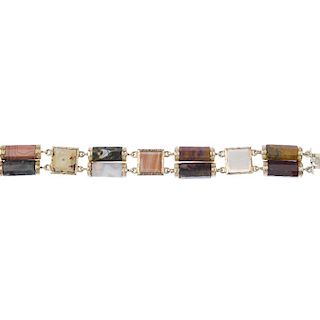 An agate bracelet. Designed as a series of square-shape agate panels, with faceted agate double spac