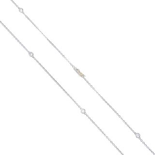 A diamond necklace. Designed as a series of brilliant-cut diamond collets, to the belcher-link chain