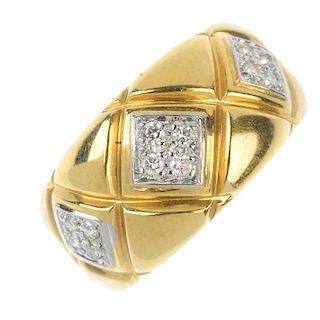 A diamond dress ring. Designed as a series of three brilliant-cut diamond lozenge-shape clusters, to