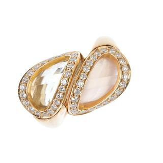A rose quartz, citrine and diamond crossover ring. Designed as a fancy-cut rose quartz and citrine,