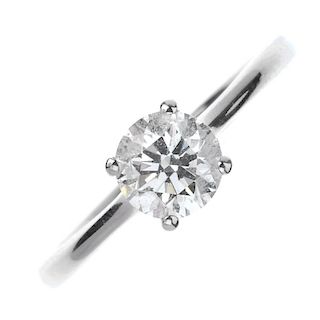 A platinum diamond single-stone ring. The brilliant-cut diamond, weighing 0.78ct, to the tapered sho