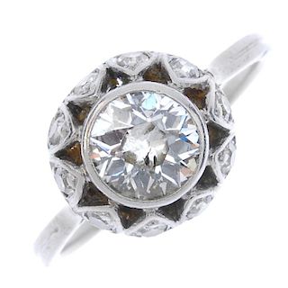A mid 20th century diamond single-stone ring. The old-cut diamond collet, within a single-cut diamon