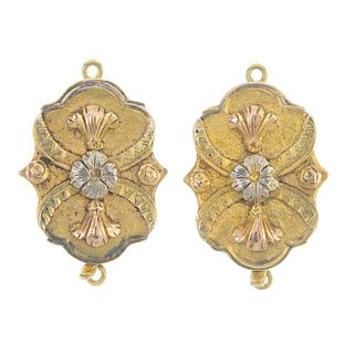 Two matching late 19th century 15ct gold clasps. Each of tri-colour design, the flower and fleur-de-