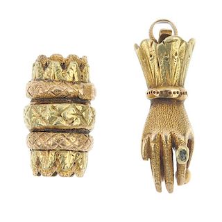 A mid 19th century gold hand clasp and a bead. To include a green-gem set textured hand clasp and a
