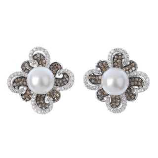 * A pair of cultured pearl, diamond and coloured diamond earrings. Each designed as a cultured pearl