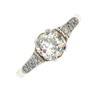 A diamond single-stone ring. The old-cut diamond, weighing 0.95ct, between single-cut diamond sides,