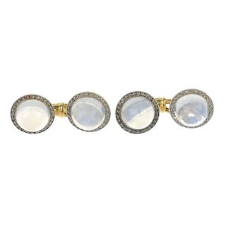 A pair of early 20th century moonstone and diamond cufflinks. Each designed as a circular moonstone