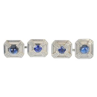 A pair of sapphire cufflinks. Each designed as a rectangular-shape panel, inset with a circular-shap