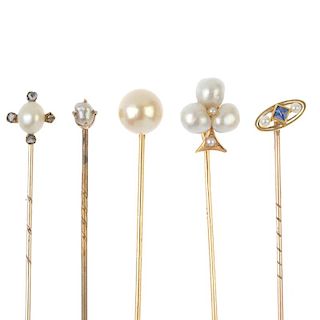 A selection of five stickpins. To include an early 20th century gold sapphire and seed pearl stickpi