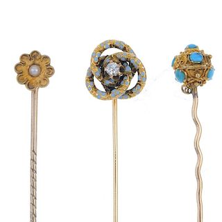 A collection of three late 19th century gold stickpins. To include a brilliant-cut diamond and blue