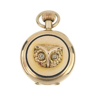 An early 20th century 15ct gold owl fob watch. The raised owl head with old-cut diamond eyes, within