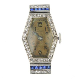 An early 20th century diamond and sapphire cocktail watch head. The hexagonal-shape dial, with black