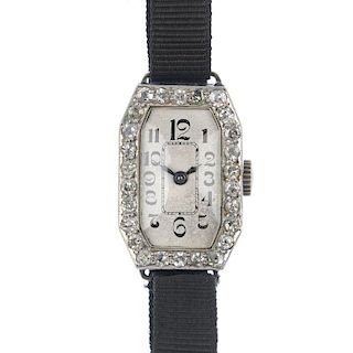 An early 20th century platinum diamond cocktail watch. The rectangular-shape cream dial, with Arabic