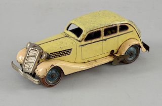 CK Toys (Kuramochi) Japan tinplate, clockwork drive 1930's 4-door saloon, unusual colour, 20cm long,