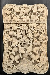 Carved Ivory Card Holder, having carved deer, birds, dogs, and figures, length 4 1/2 inches. Please note: Items containing ivory cannot be purchased o