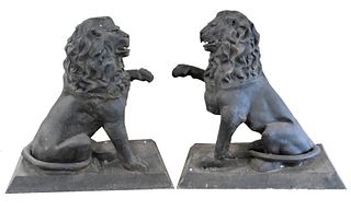 Pair of Metal Lion Figures on Rectangular Bases, each with one paw raised, height 48 inches, 21" x 46".