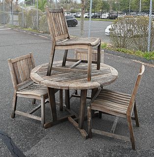New River Brazilian Cherry Five Piece Outdoor Set, to include a table, (top with small imperfection), height 29 1/2 inches, diameter 48 inches; and fo
