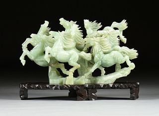 A CHINESE LARGE CELADON JADE STAMPEDING HORSES GROUP, MODERN,