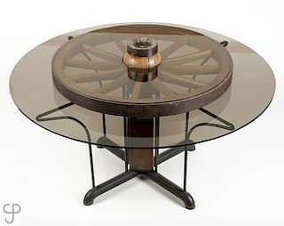 A smoked glass and wagon wheel kitchen table