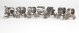 7 Victorian silver-plated carriage napkin rings