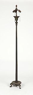 A patinated bronze floor lamp