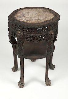 A Chinese export carved hardwood lamp table